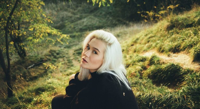 woman-in-black-long-sleeve-sweater-with-platinum-blond-hair