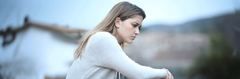 Someone experiencing sickness after an abortion